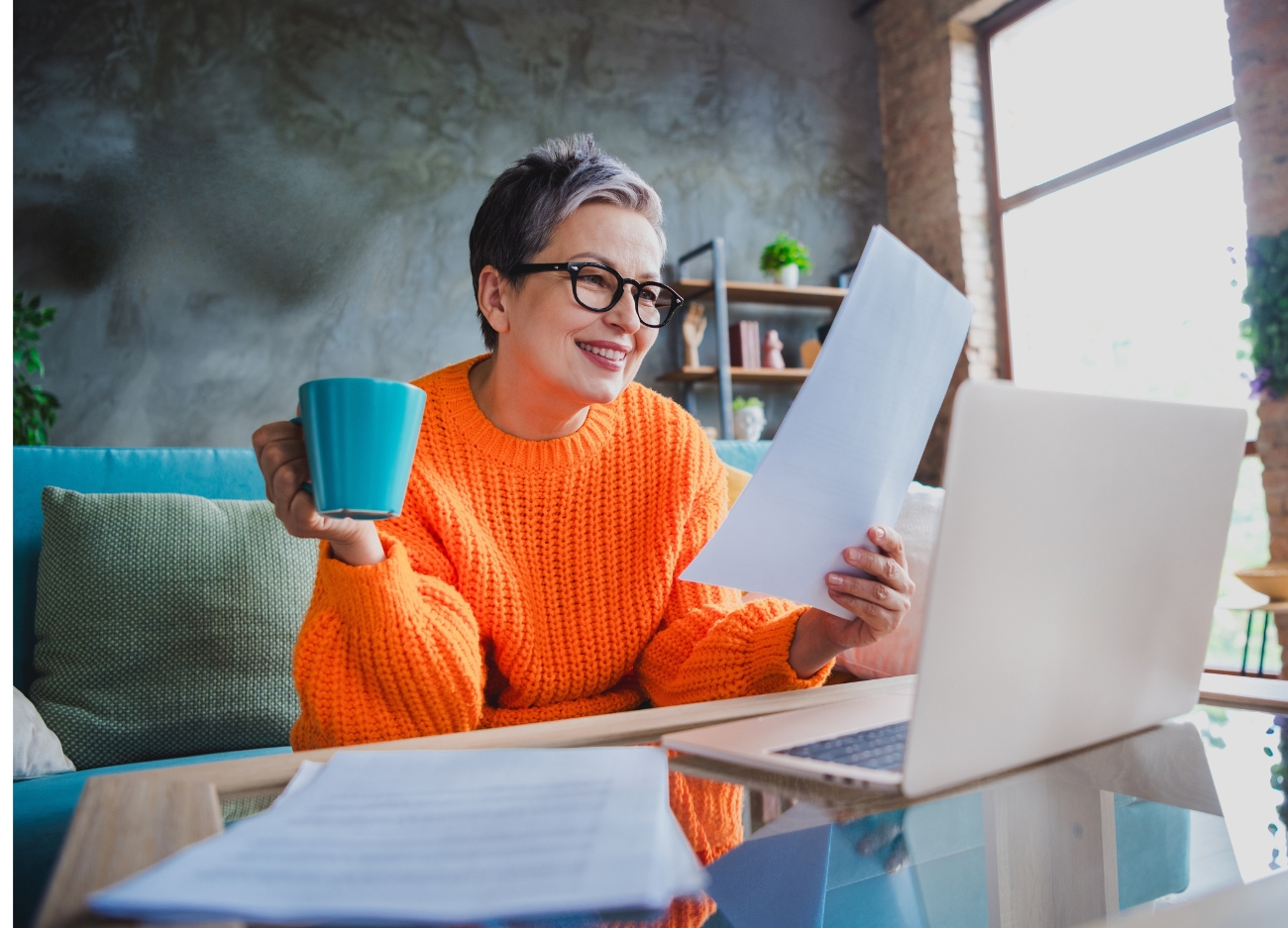 Woman reviews the results of her career assessment, smiling, happy to know it correctly assessed her
